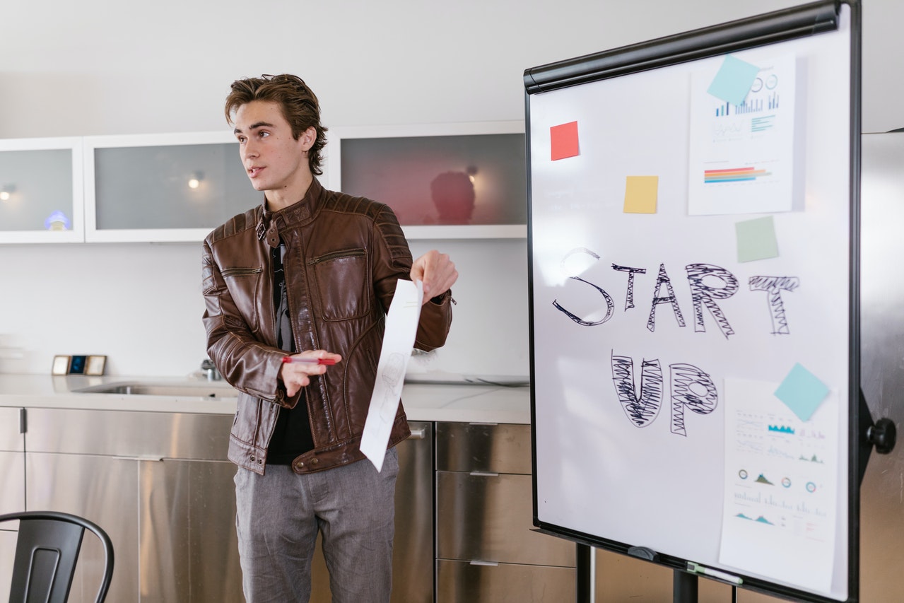 man presenting a start-up business why people choose entrepreneurship